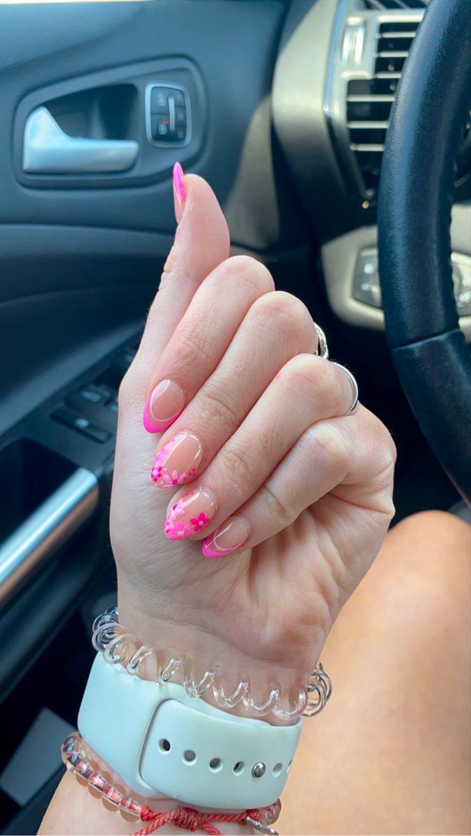 Chic Natural Base Nail Design with Vibrant Pink Tips and Floral Accents.