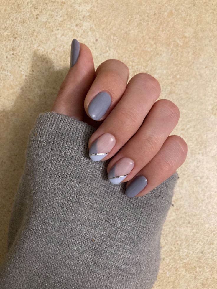 Sophisticated Minimalist Nail Design in Muted Grey and Pale Pink with Silver Accents.