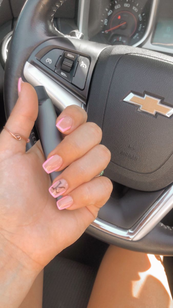 Elegant Pastel Pink Nails with Playful Marble Accent