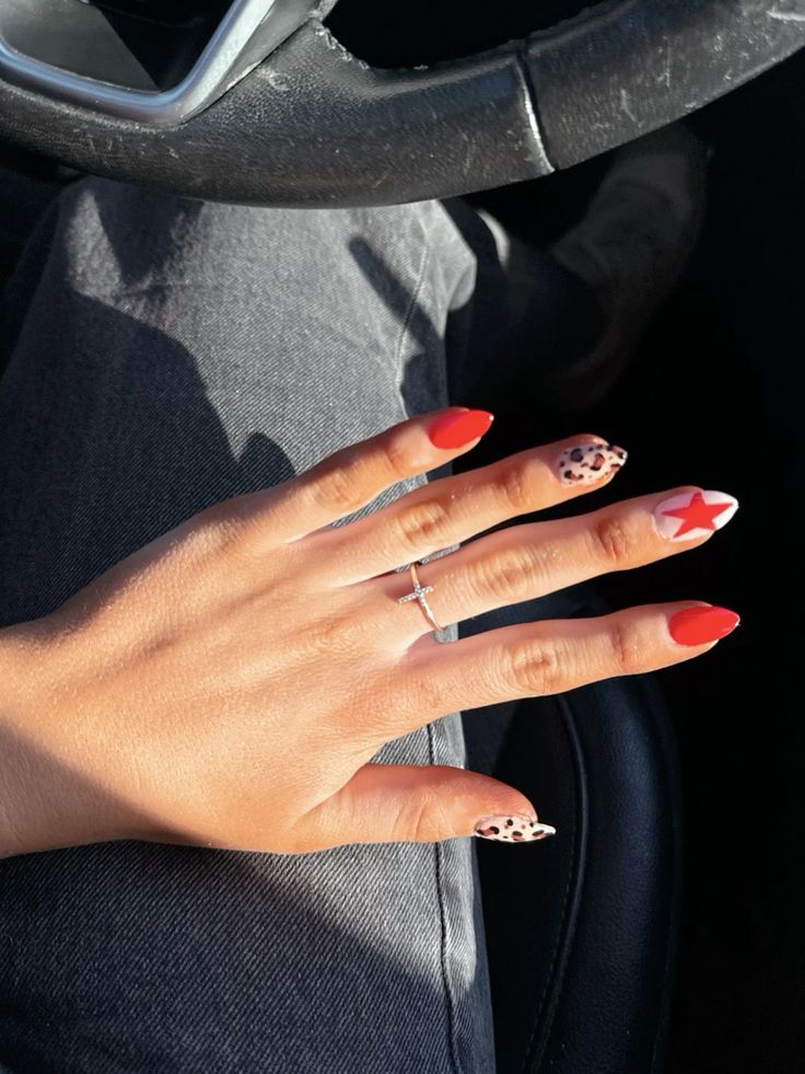 Bold Red Nail Design with Playful Patterns and Trendy Leopard Print Accents.