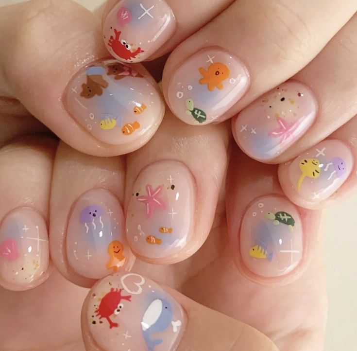 Whimsical Sea-Themed Nail Design with Playful Marine Creatures and Sparkling Accents.