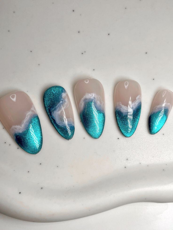 Ocean-Inspired Nail Art: Shimmering Teal Gradient with Textured Waves for a Stylish Summer Look.