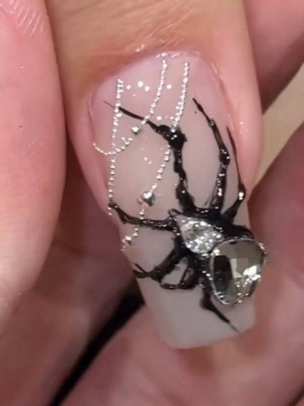 Elegant Nail Art with Black Spider and Rhinestone-Embellished Web Design.