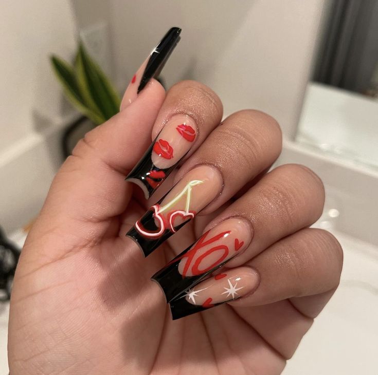 Bold Black Tip Nail Design with Playful Red and White Motifs