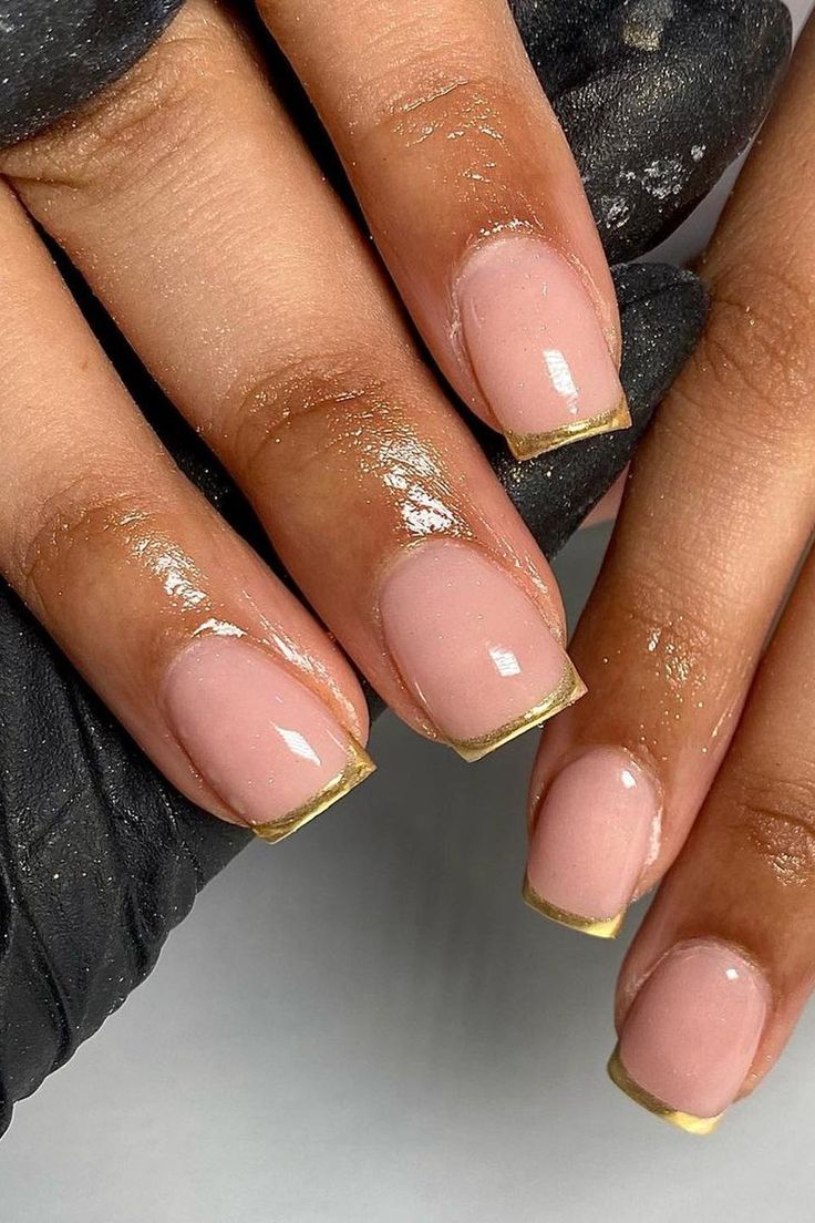 Chic Nude Manicure with Gold Tips: A Perfect Blend of Elegance and Understated Luxury