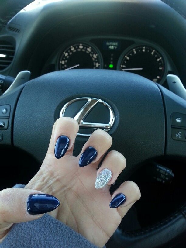 Sophisticated Dark Navy Nail Design with Glitter Accent and Modern Flair.