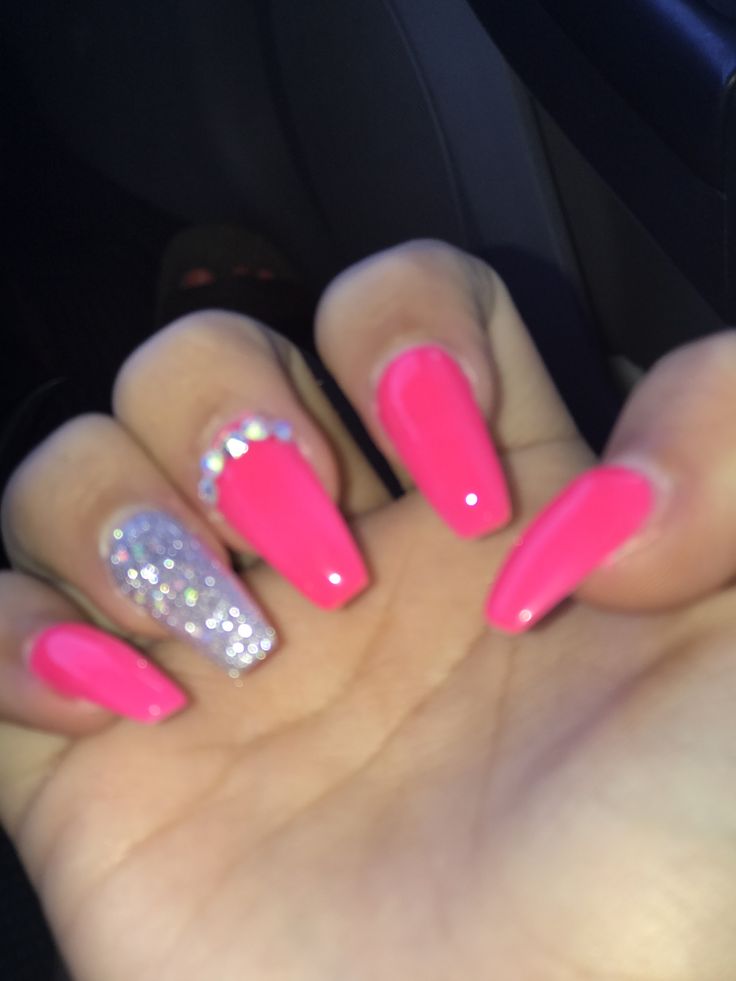 Bold Pink Nail Design with Glossy Finish and Sparkling Glitter Accent.