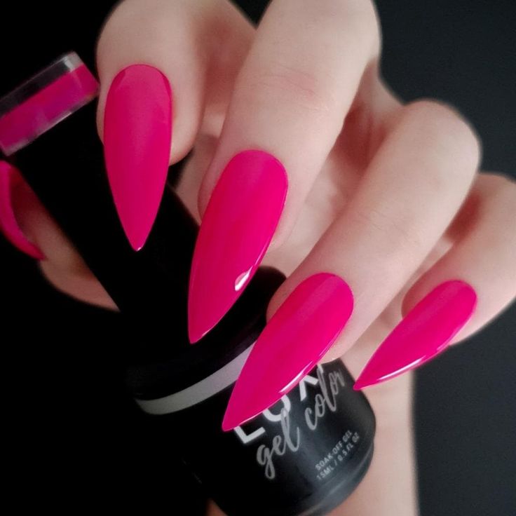 Bold Hot Pink Nail Design with Glossy Pointed Tips for a Striking Statement.