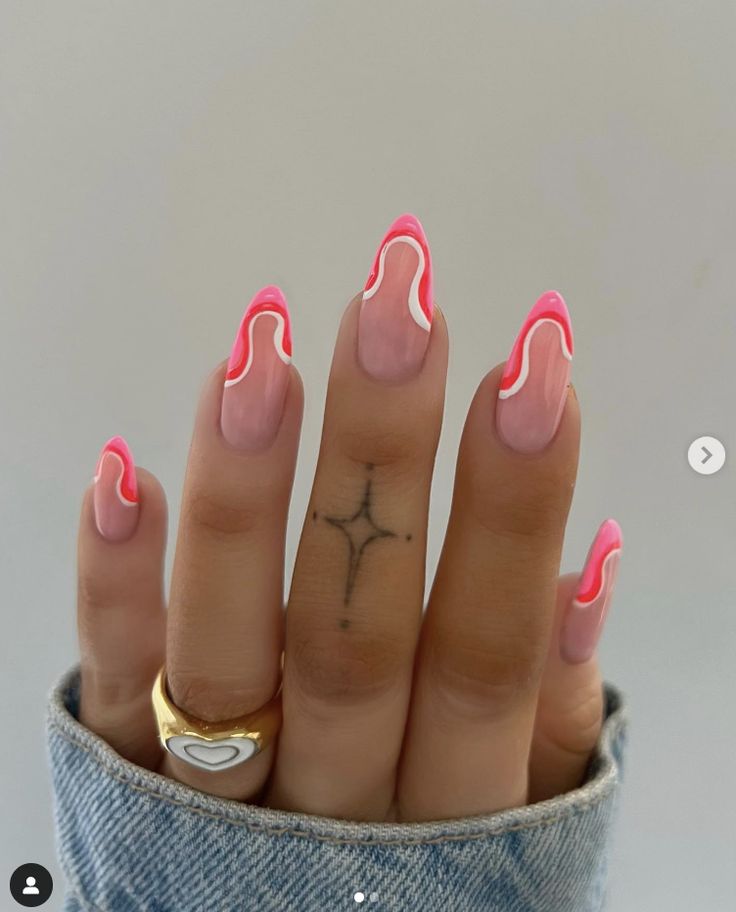 Playful Pink and Neon Coral Nail Design with Wavy White Tips for a Fun, Contemporary Look.