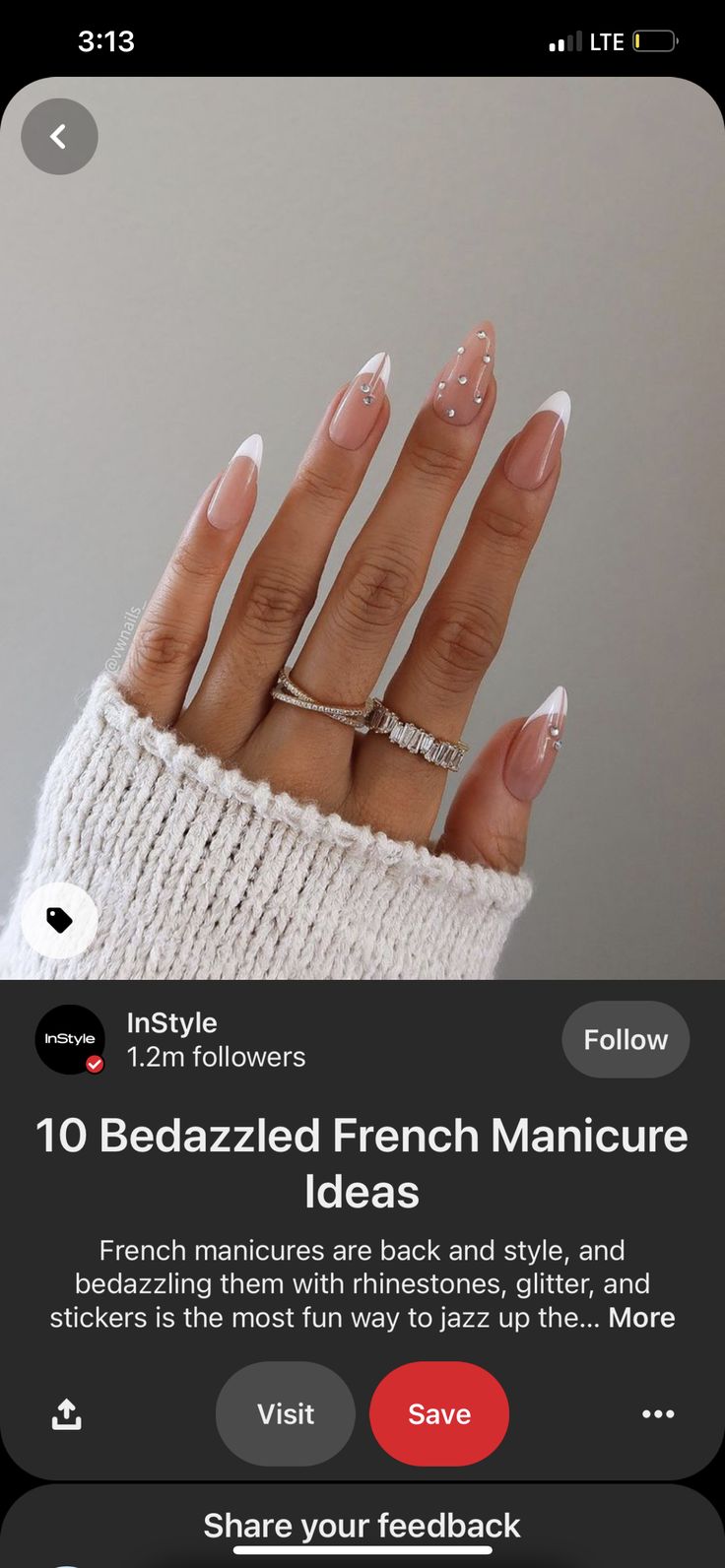 Chic Modern French Manicure with Rhinestones and Glitter Accents.