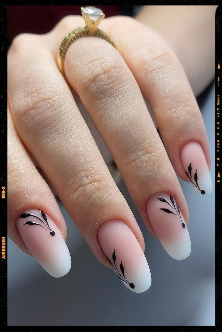 Sophisticated Ombre Nails: Soft Pink to White Gradient with Minimalist Black Art and Eye-Catching Matte-Gloss Contrast.