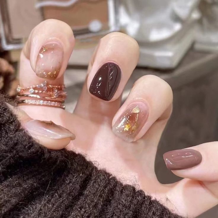 Sophisticated Nail Design: Warm Browns, Neutrals, and Glam Gold Leaf Accents