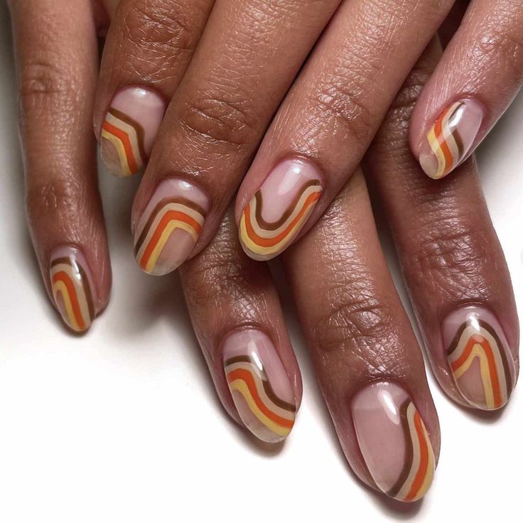 Playful Retro Wave Nail Design: Soft Beige and Vibrant Orange Stripes