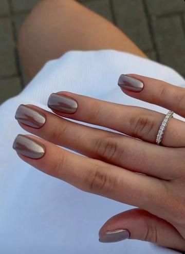 Chic Almond-Shaped Taupe Nails with Glossy Finish and Delicate Sparkling Ring.