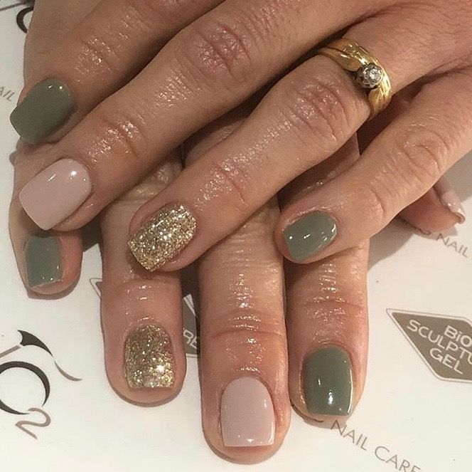 Elegant Earth-Toned Manicure with Shimmering Gold Accents.