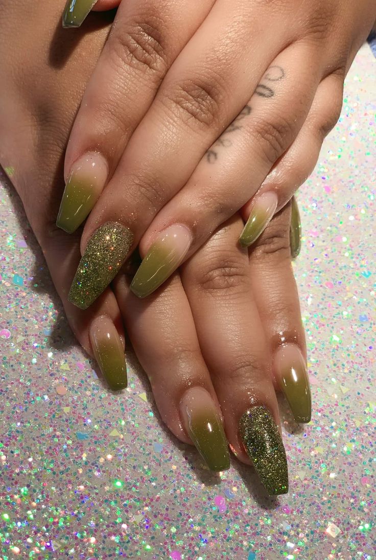 Chic Olive Green Gradient Nail Design with Sparkling Accents and Tapered Almond Shape.