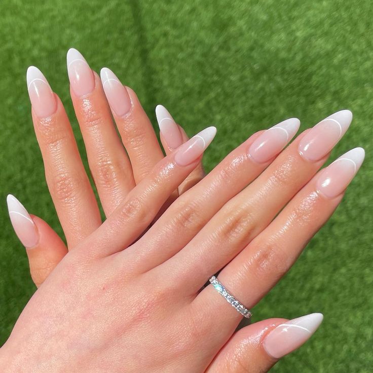 Elevate Your Look with Elegant Almond-Shaped French Tip Nails.