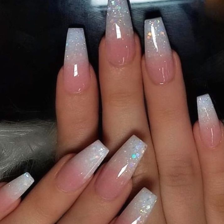 Elegant Ombre Nail Design: Soft Pink Gradient to Sparkling White Tips with a Glossy Finish