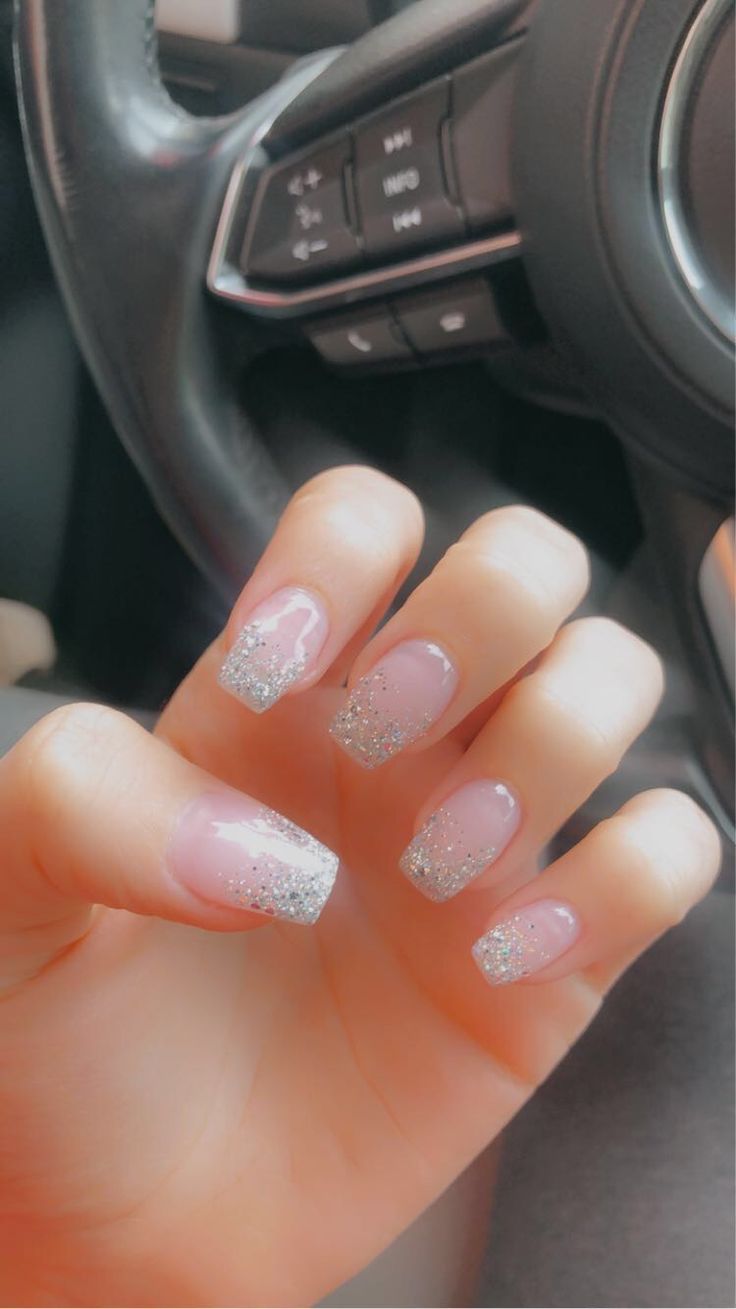 Chic Pink Nail Design with Sparkling Silver Accents and Glitter Gradient.