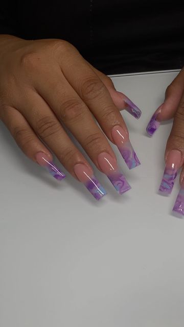 Elegant Gradient Purple Nail Art with Marbled Tips on Nude Base.