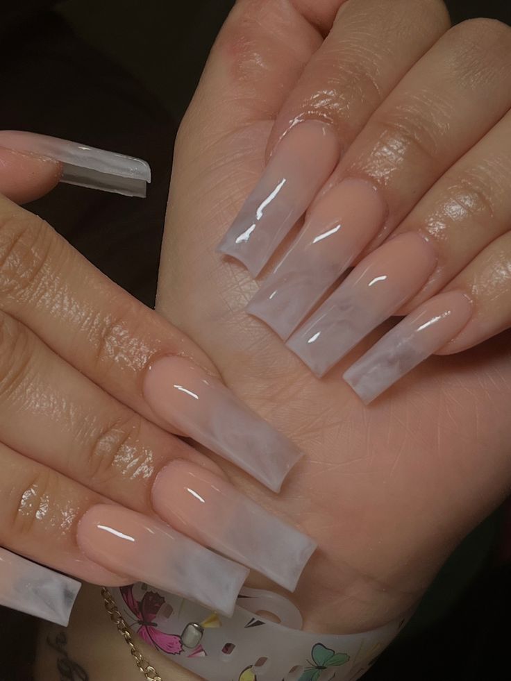 Sophisticated Long Acrylic Nails with Subtle Marble Effect and Glossy Nude Finish