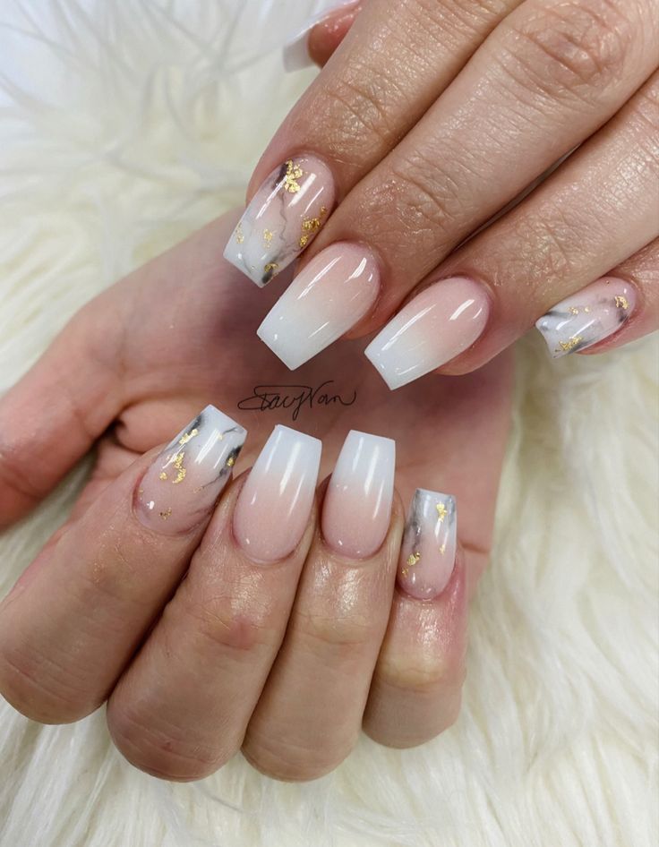 Sophisticated Ombre Nail Design with Gold Foil Accents in White and Nude Tones.