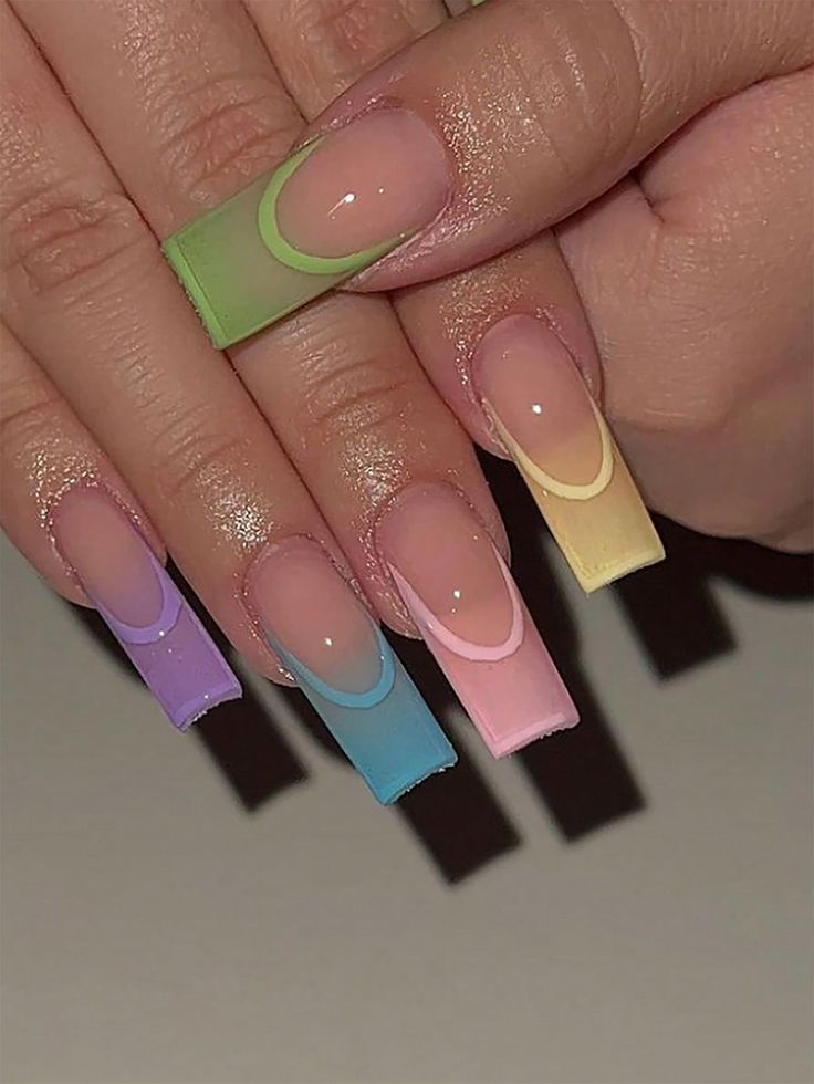 Playful Pastel Ombre Nail Design with Gradient Shades and Glossy Finish.