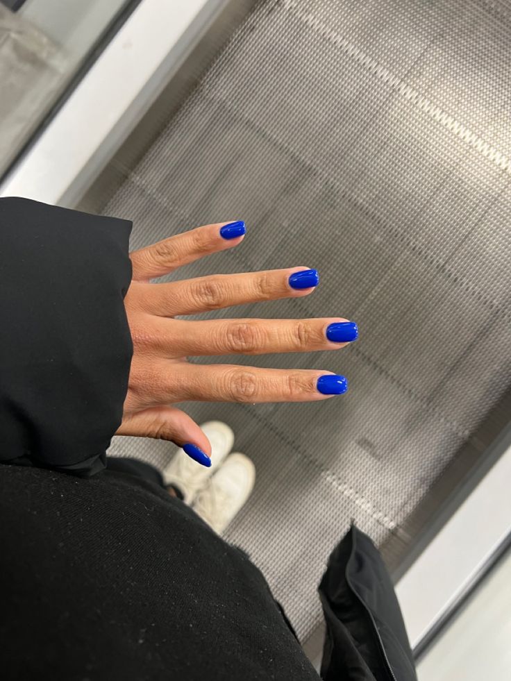 Bold Vibrant Blue Nail Design: A Glossy Finish for Confident, Playful Style.