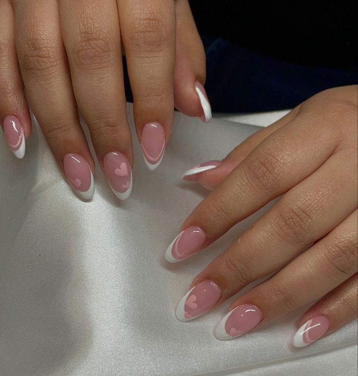 Chic Romantic Pink Nail Design with Delicate White Tips and Heart Motifs