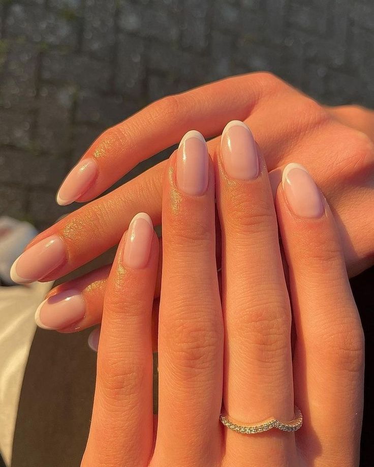 Chic Nude Nail Designs with Delicate White Tips and Subtle Shimmer for Versatile Elegance.