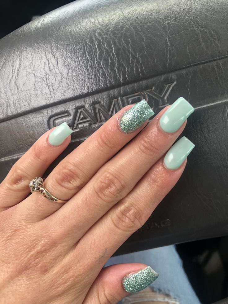 Chic Mint Green Nails with Glamorous Glitter Accent.