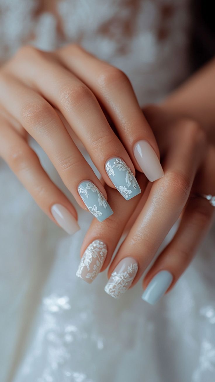 Sophisticated Pastel Nail Design with Floral Patterns for Special Occasions.