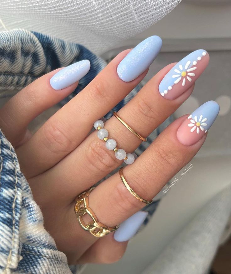 Elegant Blue and Pink Nail Design with Floral Accents and Gold Accents