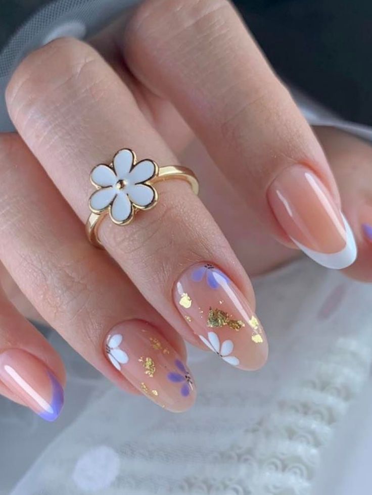 Charming Floral Nail Design with Soft Nude Base and Gold Accents.