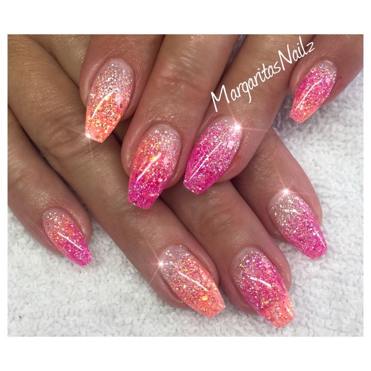 Vibrant Pink and Peach Gradient Nail Design with Sparkling Glitter for a Glamorous Finish