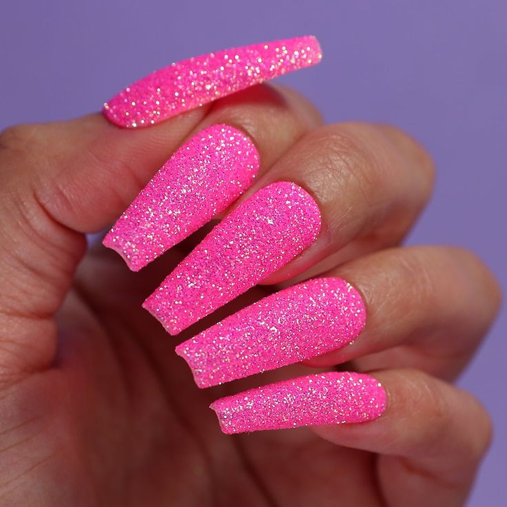 Playful Glittery Pink Nail Design for a Bold Look.