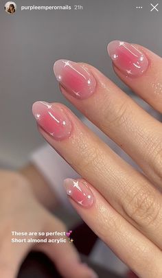 Elegant Short Almond Acrylic Nails with Romantic Pink Shades and Glittering Star Accents.