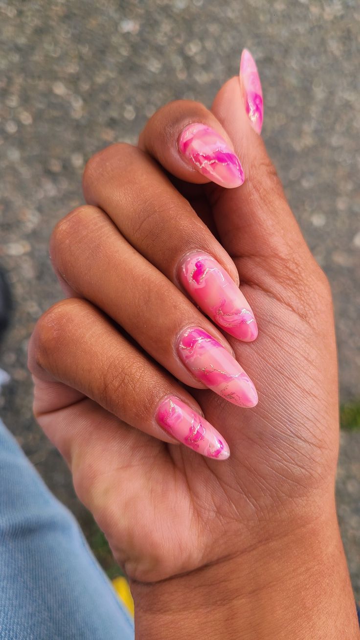 Elegant Marbled Pink Nail Design with Fuchsia Swirls for a Stylish Look.