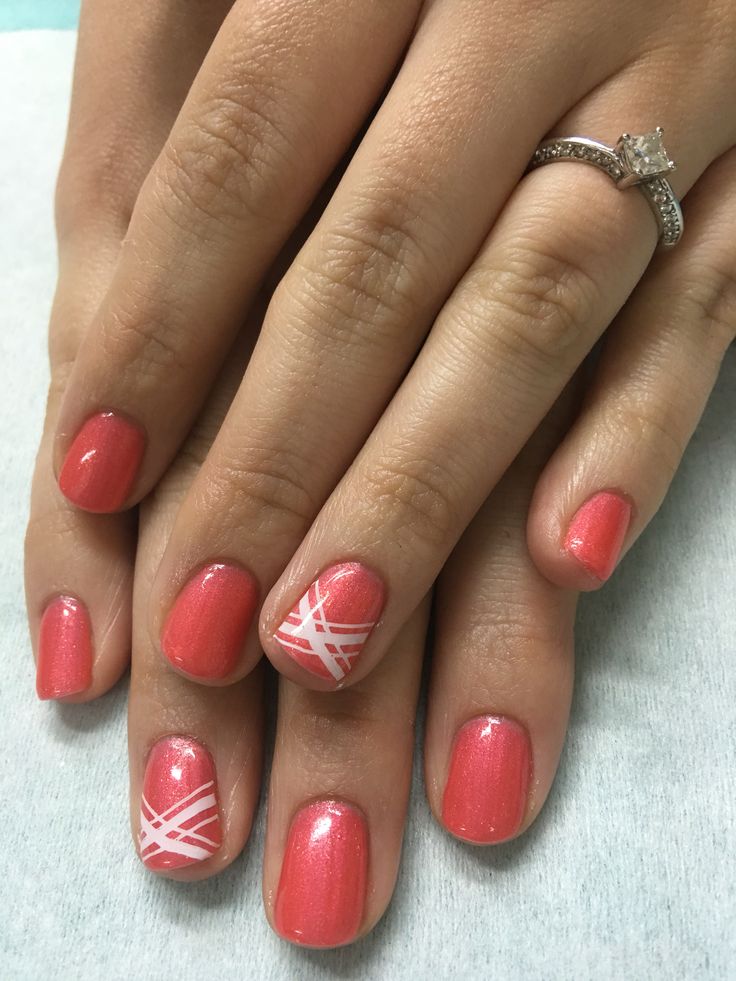 Vibrant Coral Nail Design with Shimmering Finish and Intricate White Accents