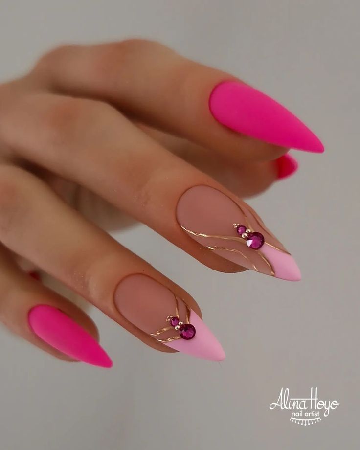 Chic Nail Design: Vibrant Pink and Soft Nude with Gold Accents and Gemstones