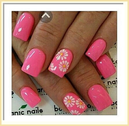 Charming Pink Nail Design with Floral Accents for a Cheerful Manicure.