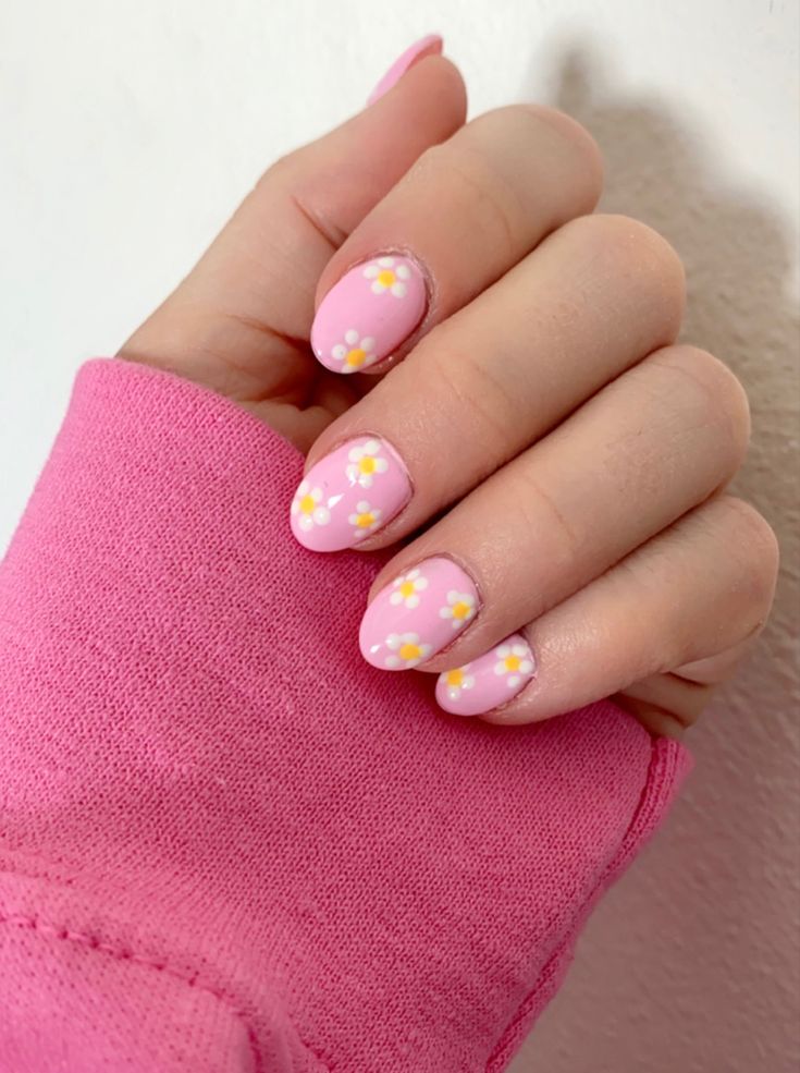 Charming Floral Nail Design: Delicate Pink with Playful White and Yellow Accents for a Fresh Spring Aesthetic.