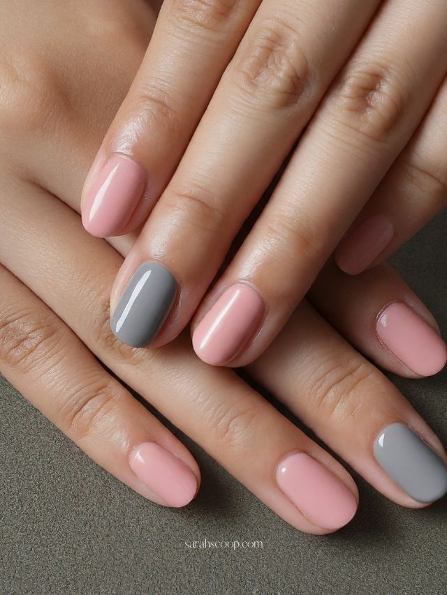 Chic Pastel Nail Design: Stylish Color Blocked Elegance in Muted Pink and Gray.