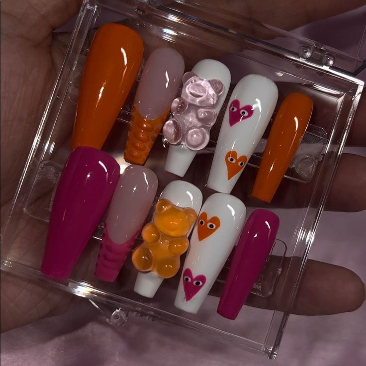 Playful Colorful Nail Design Set with Heart Motifs and Unique Finishes.