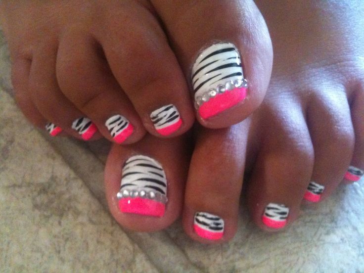 Vibrant Zebra Stripes Pedicure with Neon Pink Accents and Unique Patterns.