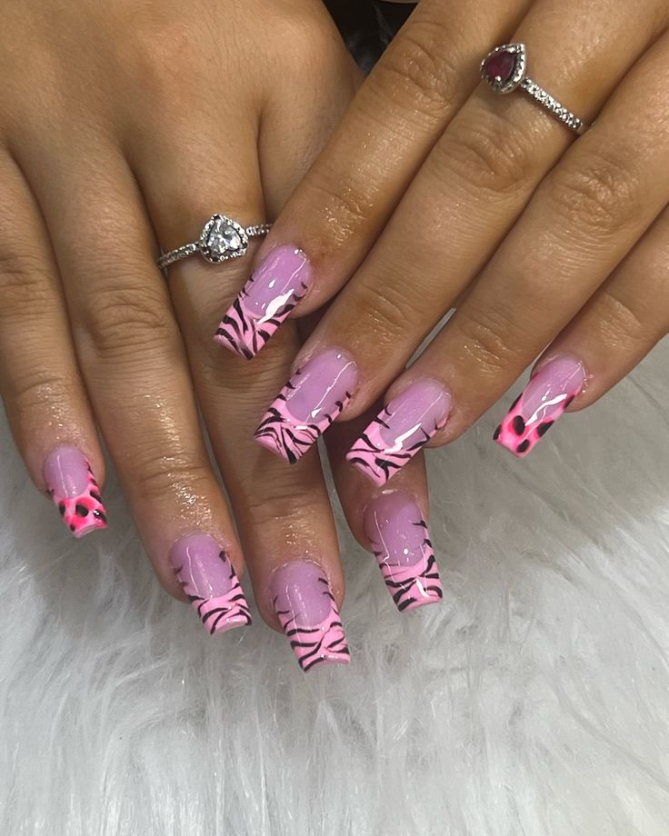 Playful Pink and Bold Zebra Nail Design with Vibrant Neon Accents.