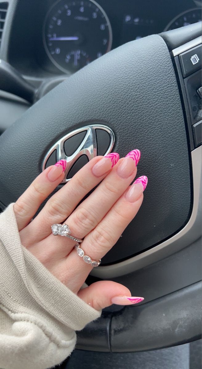 Elegant Nail Design: Soft Nude with Bold Pink Zigzag Tips & Delicate Rings