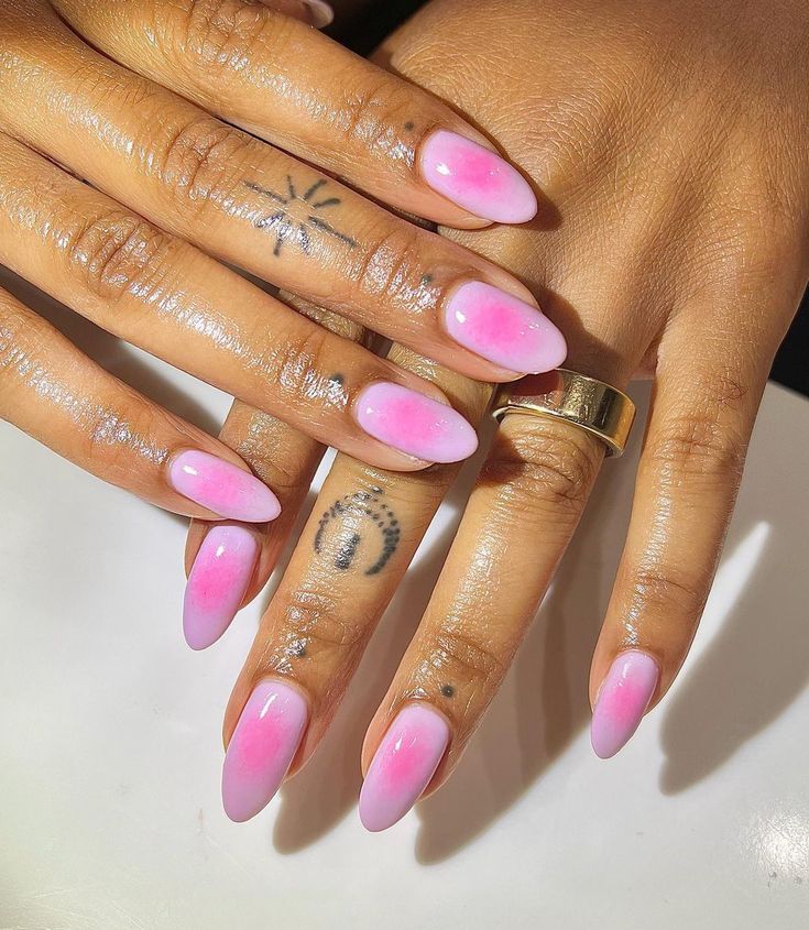 Elegant Ombre Gradient Pink Nails with Glossy Finish and Chic Accents.