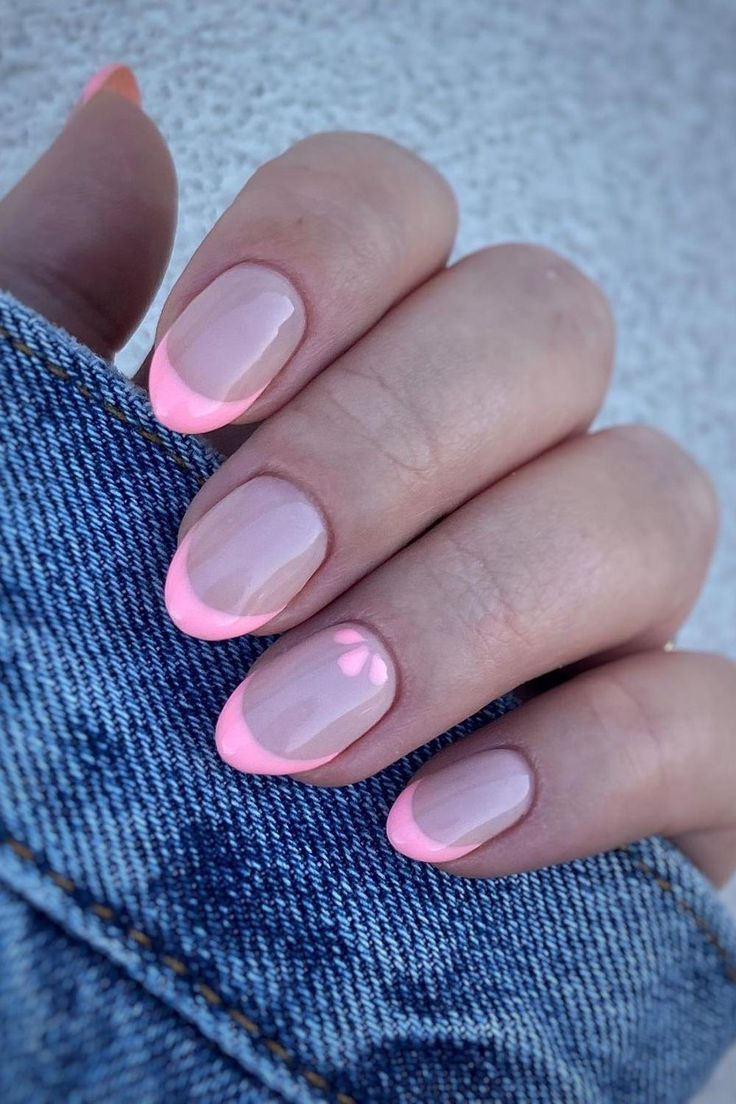 Playful Elegance: Chic Nail Design with Vibrant Pink French Tips and Heart Accent