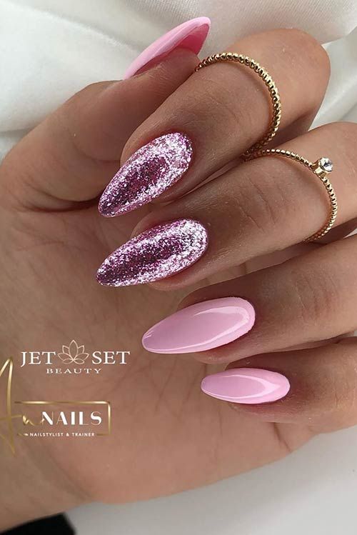 Chic Almond-Shaped Nails: Soft Pink and Glitter Elegance with Playful Accents.